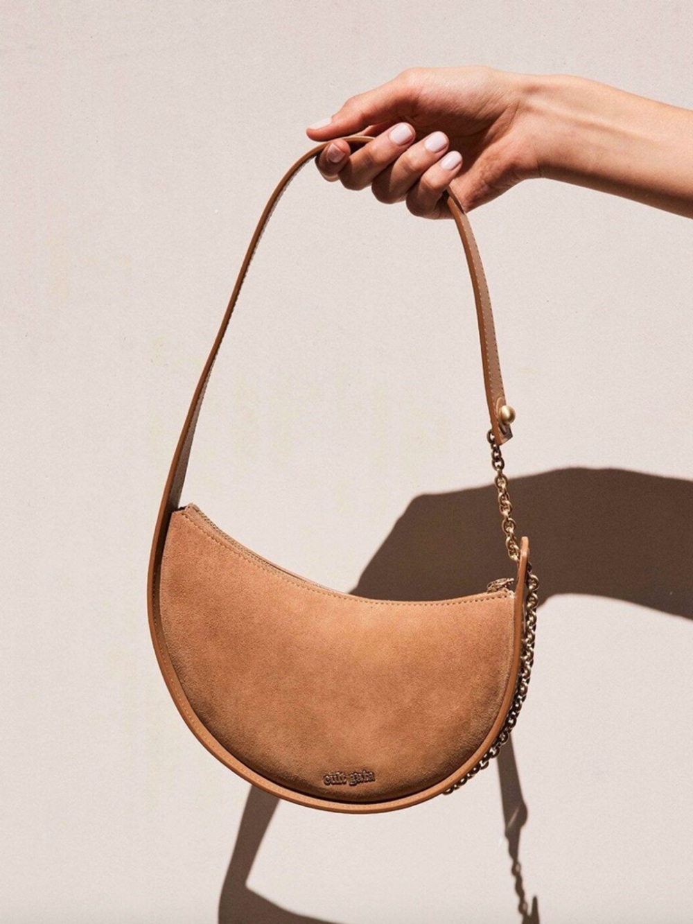cult gaia tan crescent shoulder bag with gold chain strap